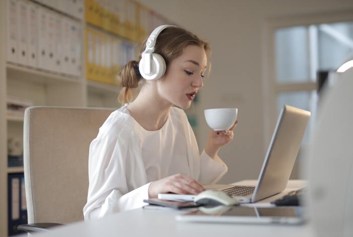 selective-focus-photo-of-woman-in-headphone-listening-to-3770272